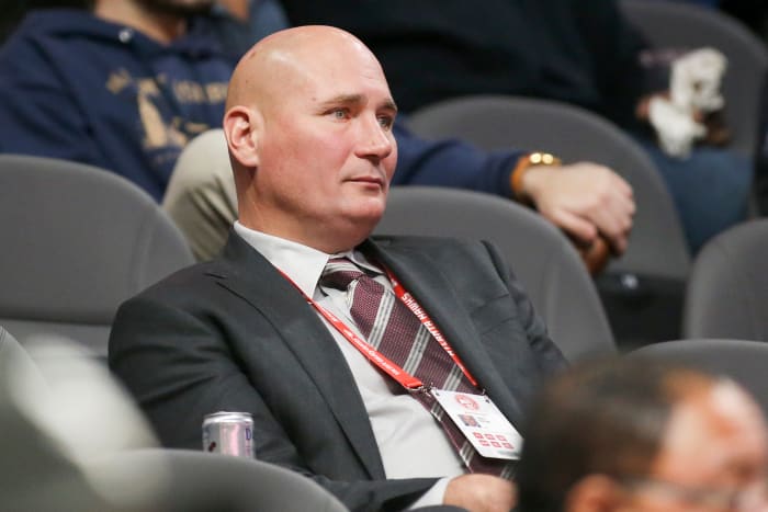 Travis Schlenk watches a game from the stands.